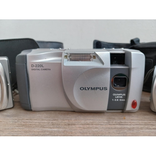 437 - Three digital cameras, one Konica Minolta DiMAGE G600 6mp, one Olympus D-220L and one cased Olympus ... 