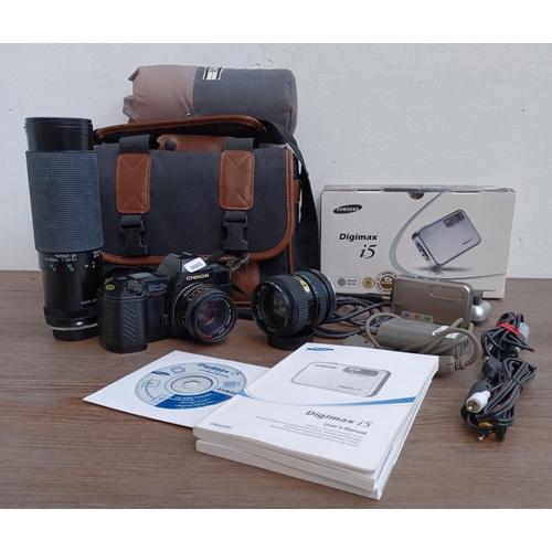 438 - Two items, one camera case containing Chinon CP-7m 35mm SLR fitted with Chinon auto 1:1.9 50mm lens,... 