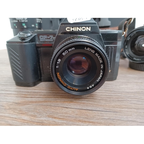 438 - Two items, one camera case containing Chinon CP-7m 35mm SLR fitted with Chinon auto 1:1.9 50mm lens,... 