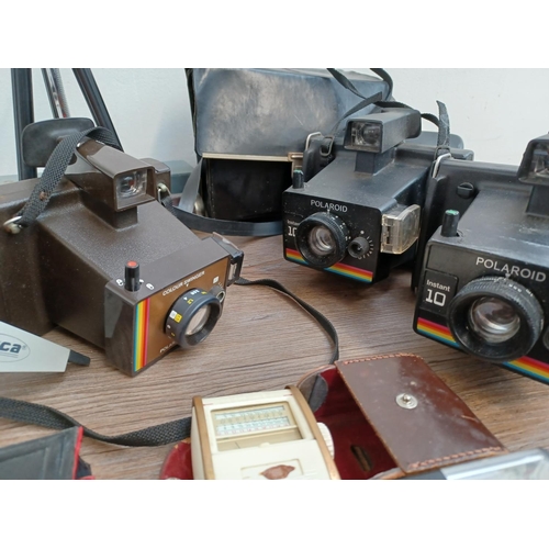 442 - A collection of vintage cameras and accessories to include boxed and cased Rexina De Luxe tripod, ca... 