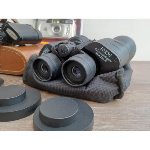 445 - A collection cameras and binoculars to include cased Olympus XA2 35mm compact camera fitted with D.Z... 