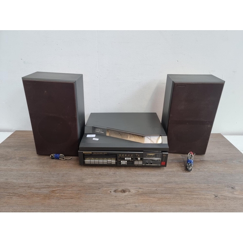 476 - A Panasonic SG-X10 stereo music system comprising two speed turntable, cassette player, two band rad... 