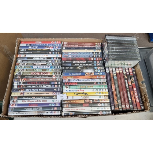 511 - A box containing a collection of sealed DVDs - see images for titles