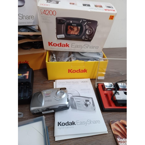 451 - A collection of Kodak items to include boxed EasyShare Camera Dock II and CX4200 digital camera, cas... 