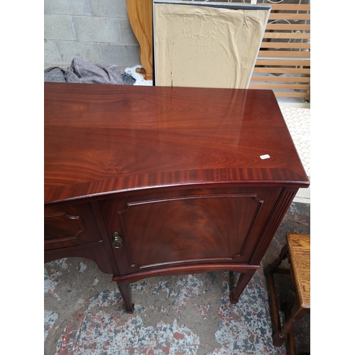 387 - A Regency style mahogany sideboard with one central drawer and two outer cupboard doors - approx. 91... 