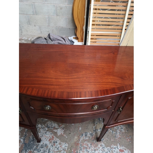 387 - A Regency style mahogany sideboard with one central drawer and two outer cupboard doors - approx. 91... 