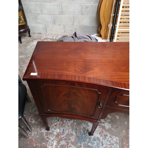 387 - A Regency style mahogany sideboard with one central drawer and two outer cupboard doors - approx. 91... 