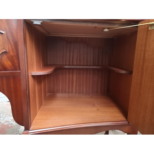 387 - A Regency style mahogany sideboard with one central drawer and two outer cupboard doors - approx. 91... 