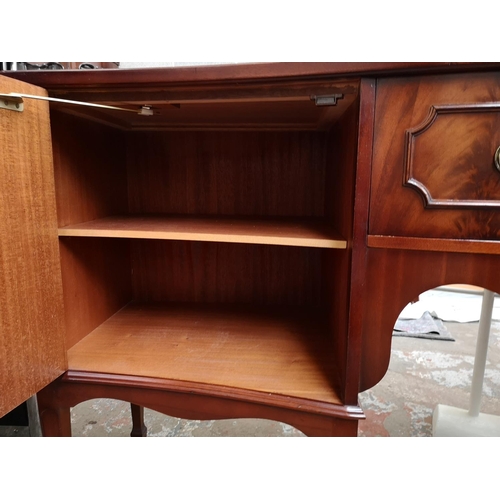 387 - A Regency style mahogany sideboard with one central drawer and two outer cupboard doors - approx. 91... 