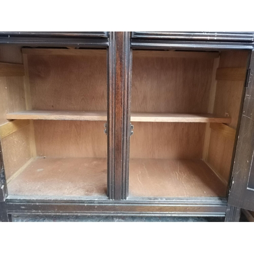 390 - An oak dresser with two drawers, two cupboard doors and upper plate rack