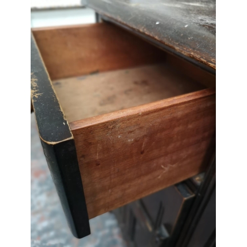 390 - An oak dresser with two drawers, two cupboard doors and upper plate rack