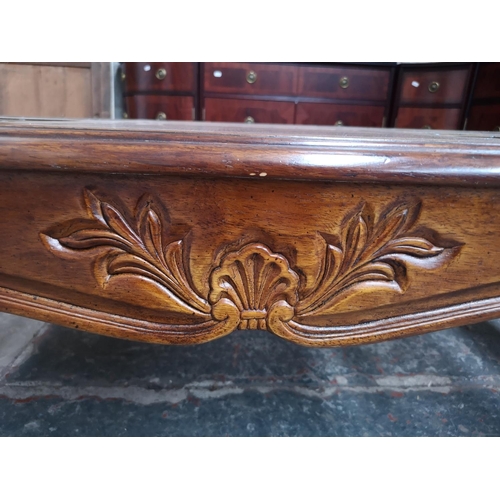 394 - A late 20th century hardwood and stained glass rectangular coffee table