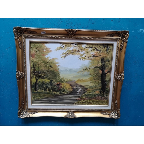 406 - Three gilt framed pictures, two oil paintings, one of a cattle scene signed S. Butler - approx. 63cm... 