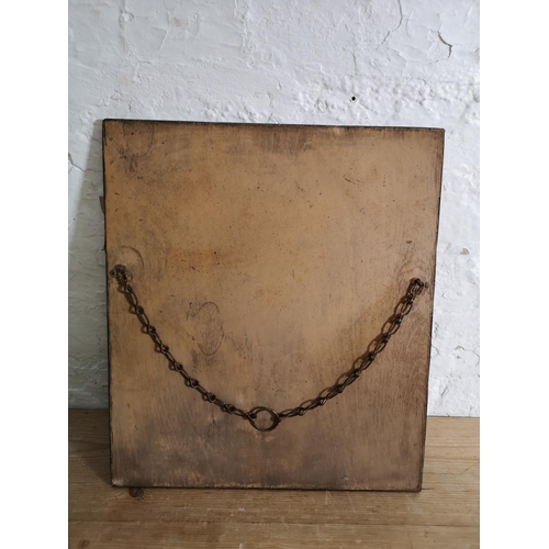 418 - A vintage brass framed bevelled edge wall mirror with foliate design - approx. 41cm high x 36cm wide