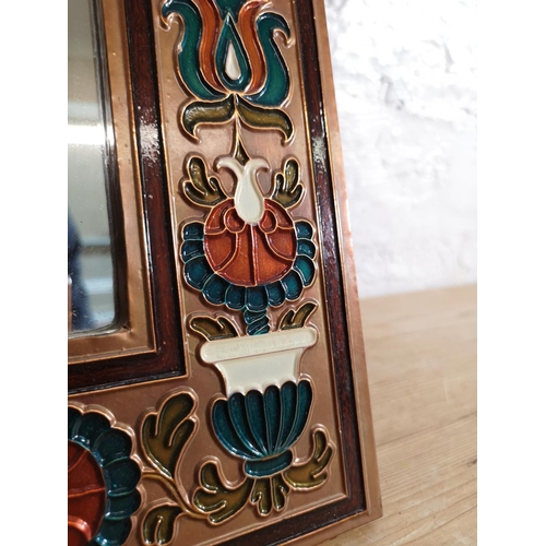 425 - An Indian copper and enamel framed wall mirror - approx. 60cm high x 41cm wide