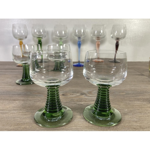 28 - Eighteen pieces of coloured glassware, six 20cm wine glasses, six shot glasses and six 11cm green gl... 