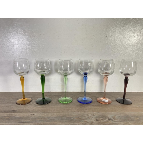 28 - Eighteen pieces of coloured glassware, six 20cm wine glasses, six shot glasses and six 11cm green gl... 