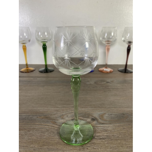 28 - Eighteen pieces of coloured glassware, six 20cm wine glasses, six shot glasses and six 11cm green gl... 