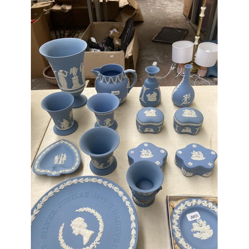 32 - A collection of Wedgwood pale blue Jasperware to include 19cm trumpet vase, 12cm jug stamped 