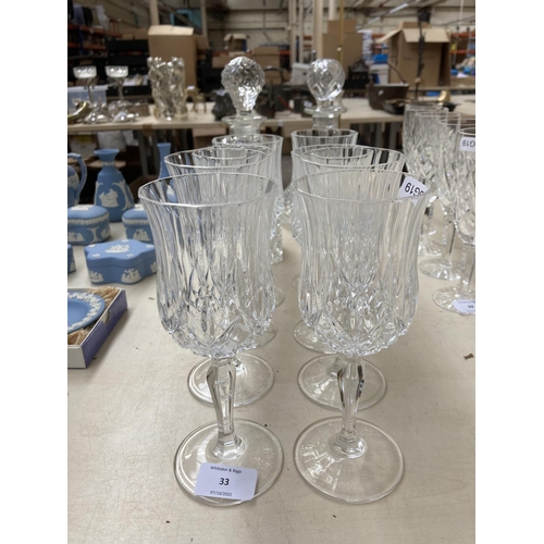 33 - Ten pieces of crystal glassware, two decanters, four 19cm glasses and four 18cm glasses