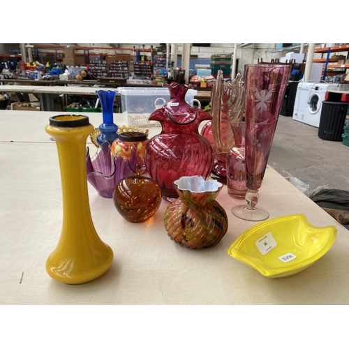 56 - A collection of coloured glassware to include Victorian cranberry glass, yellow glass vase with hall... 