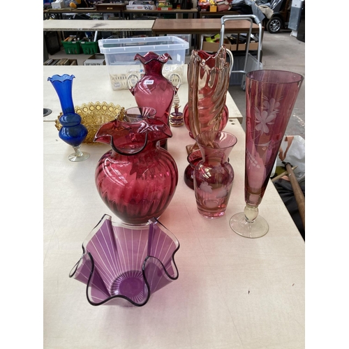 56 - A collection of coloured glassware to include Victorian cranberry glass, yellow glass vase with hall... 