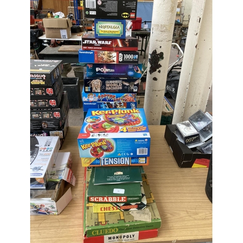 75 - Seventeen boxed games and jigsaw puzzles to include Lego Batman, Cluedo, Monopoly etc.