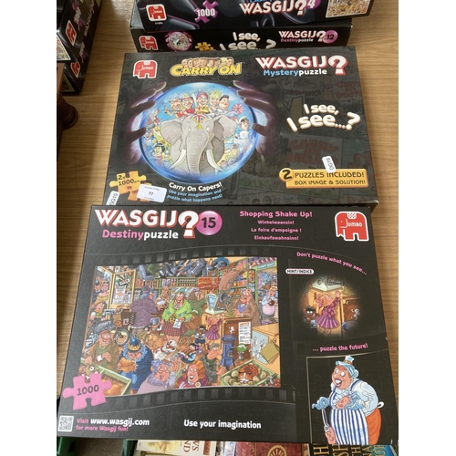 77 - Seven boxed Jumbo Wasgij jigsaw puzzles