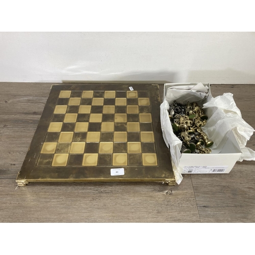 83 - A brass and pewter chess set