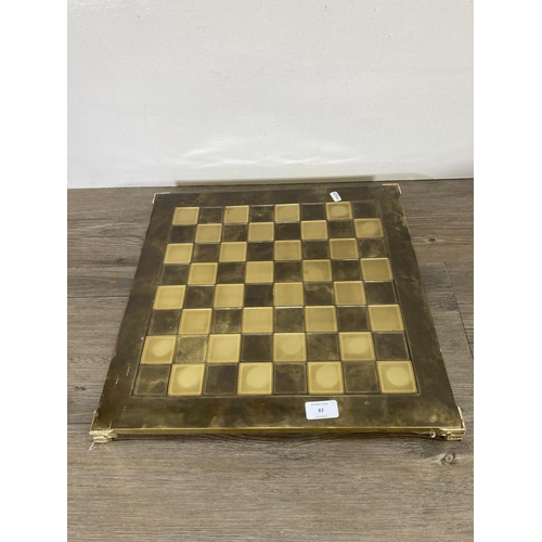 83 - A brass and pewter chess set
