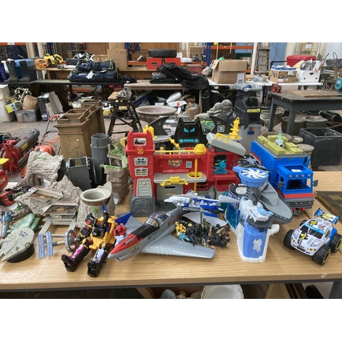 85 - A large collection of toys and games to include Thunderbirds Tracy Island and model aircrafts, figur... 