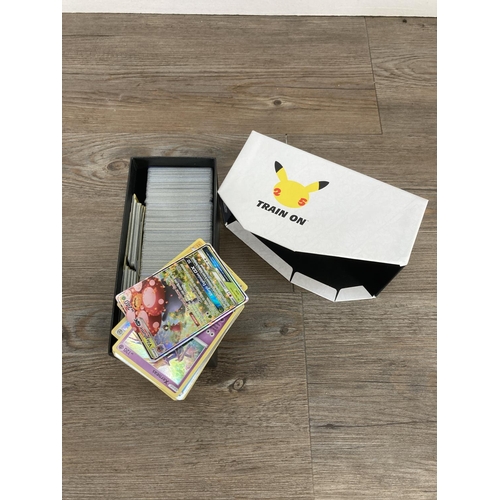 91 - A collection of Pokémon trading cards and accessories