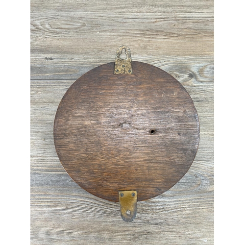 189 - An early 20th century oak cased barometer - approx. 20cm diameter