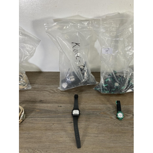 137 - Four bags containing a large quantity of wristwatches to include Lorus water resistant quartz etc.