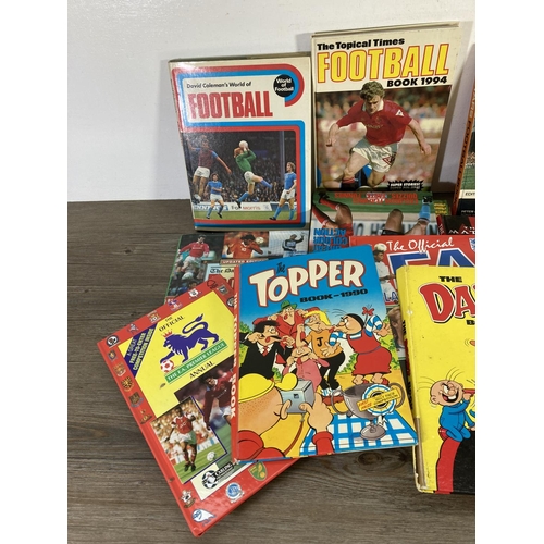 151 - Fourteen annuals and books to include The Topper 1990, The Official Gazza children's annual, Shoot e... 