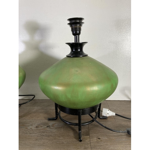 176 - A pair of green ceramic and black metal table lamps - approx. 43cm high