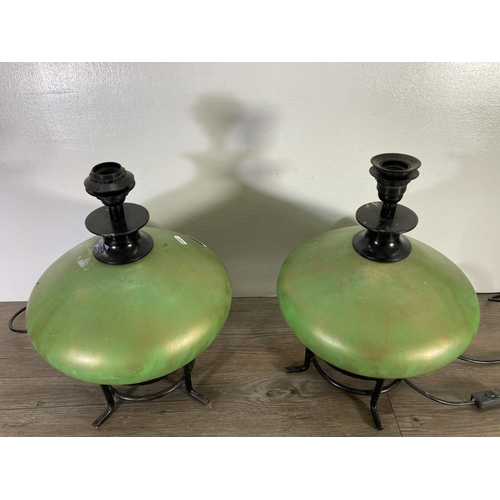 176 - A pair of green ceramic and black metal table lamps - approx. 43cm high