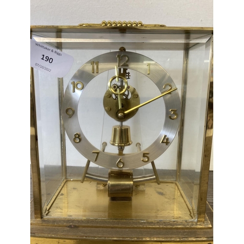 190 - A Kundo electronic brass and glass cased mantle clock - approx. 20cm high x 19cm wide x 12cm deep