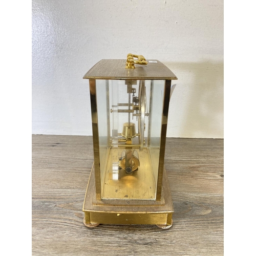 190 - A Kundo electronic brass and glass cased mantle clock - approx. 20cm high x 19cm wide x 12cm deep