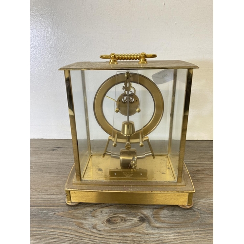 190 - A Kundo electronic brass and glass cased mantle clock - approx. 20cm high x 19cm wide x 12cm deep