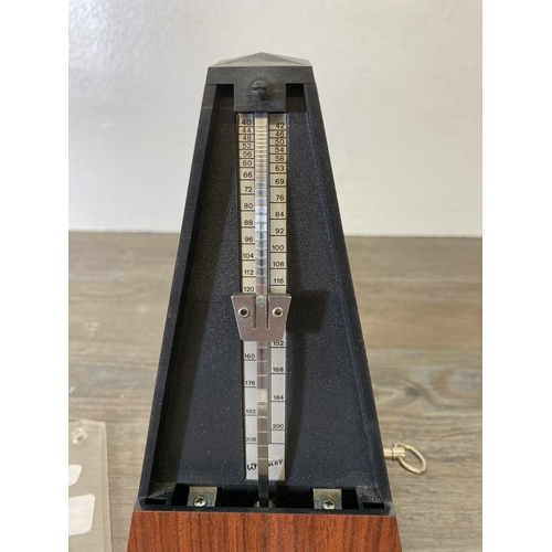 199 - A Wittner mahogany effect metronome - approx. 21cm high