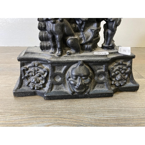 207 - A Victorian style cast iron Punch doorstop - approx. 34cm high