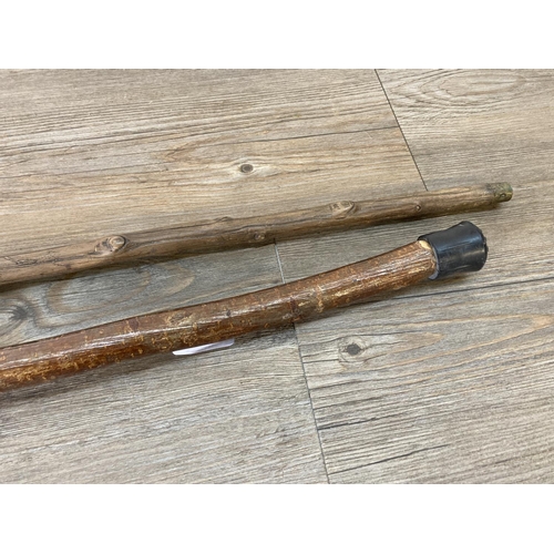 212 - Two vintage walking canes, one with white metal top and one with carved dog head top