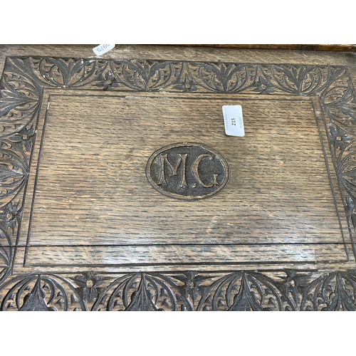 215 - Three pieces of treenware, one early 20th century carved oak twin handled tray, monogrammed M.G - ap... 