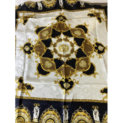 218 - Four silk fashion scarves