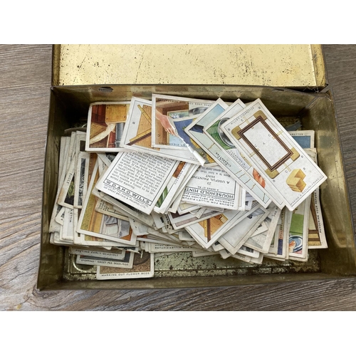 223 - Six items to include a vintage tin containing cigarette cards, wooden biscuit barrel, pine trinket b... 