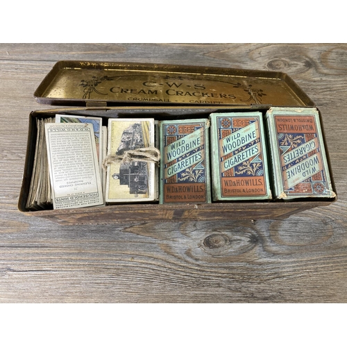 223 - Six items to include a vintage tin containing cigarette cards, wooden biscuit barrel, pine trinket b... 