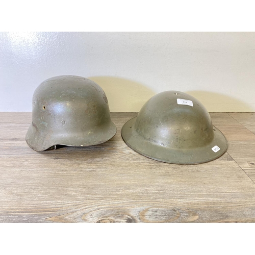 233 - Two WWII helmets