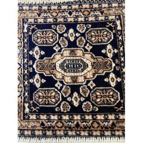 234 - A Moroccan acrylic and viscose prayer mat - approx. 35cm x 35cm