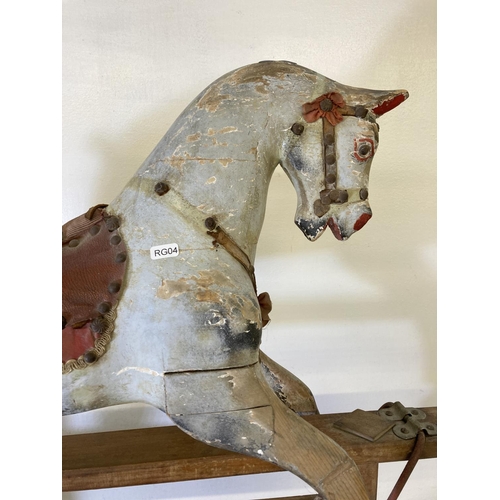 235 - A mid 20th century hand painted wooden rocking horse on beech stand - approx. 79cm high x 33cm wide ... 